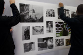 Two students holding up a grid of photos on a white background.