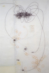 Semi-translucent, white cloth material embroidered with thin black and yellow linework. A cluster of embroidered black lines gather at the top of the fabric. At their center is a group of words that have been embroidered onto the fabric. They overlap with such density that they are illegible. Small embroidered yellow circles decorate the lower half and right corner of the fabric.