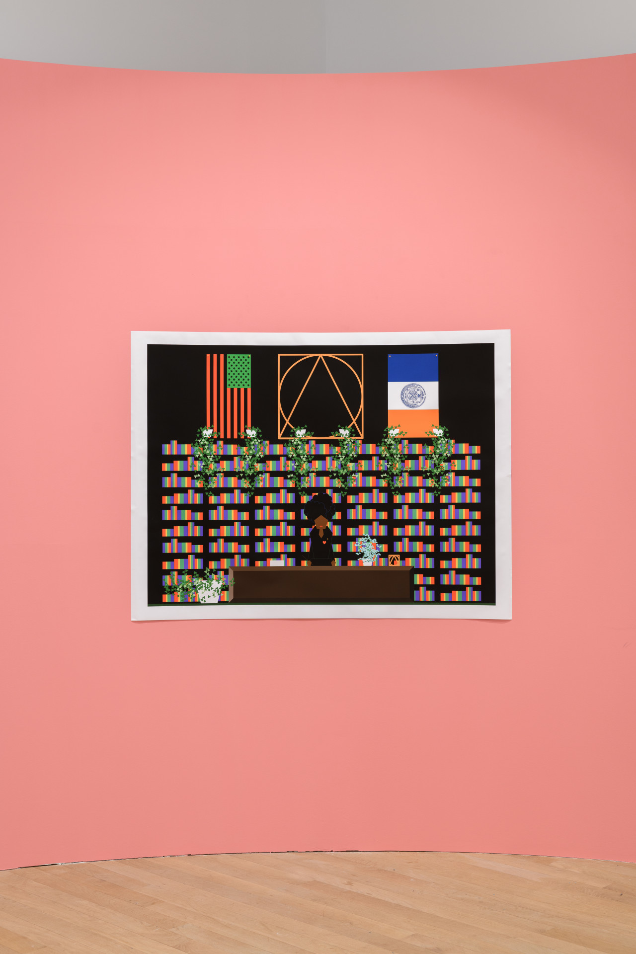 An inkjet print mounted on a pink wall. The print includes a woman standing behind a desk and in front of several rainbow-colored bookshelves. Above the bookshelves hang several flags.