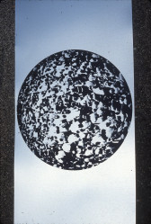 A circular shape with a textured fill on a blue background.