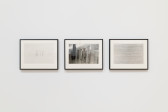 A display of multiple images on a white gallery wall.