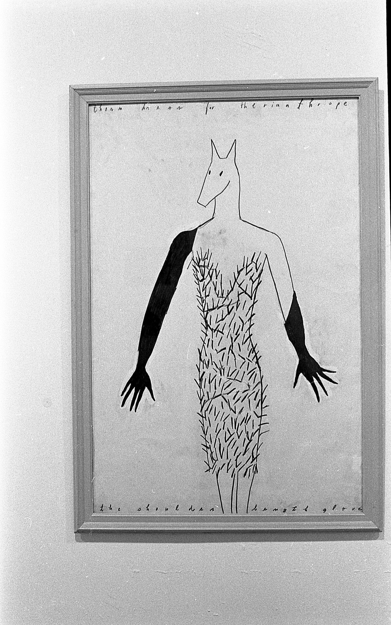 A simple drawing of a figure with a horse-like head wearing a dress and black gloves. Text along the top reads: "thorn dress for the rianthrope." Text along the bottom reads "the shoulder length glove."