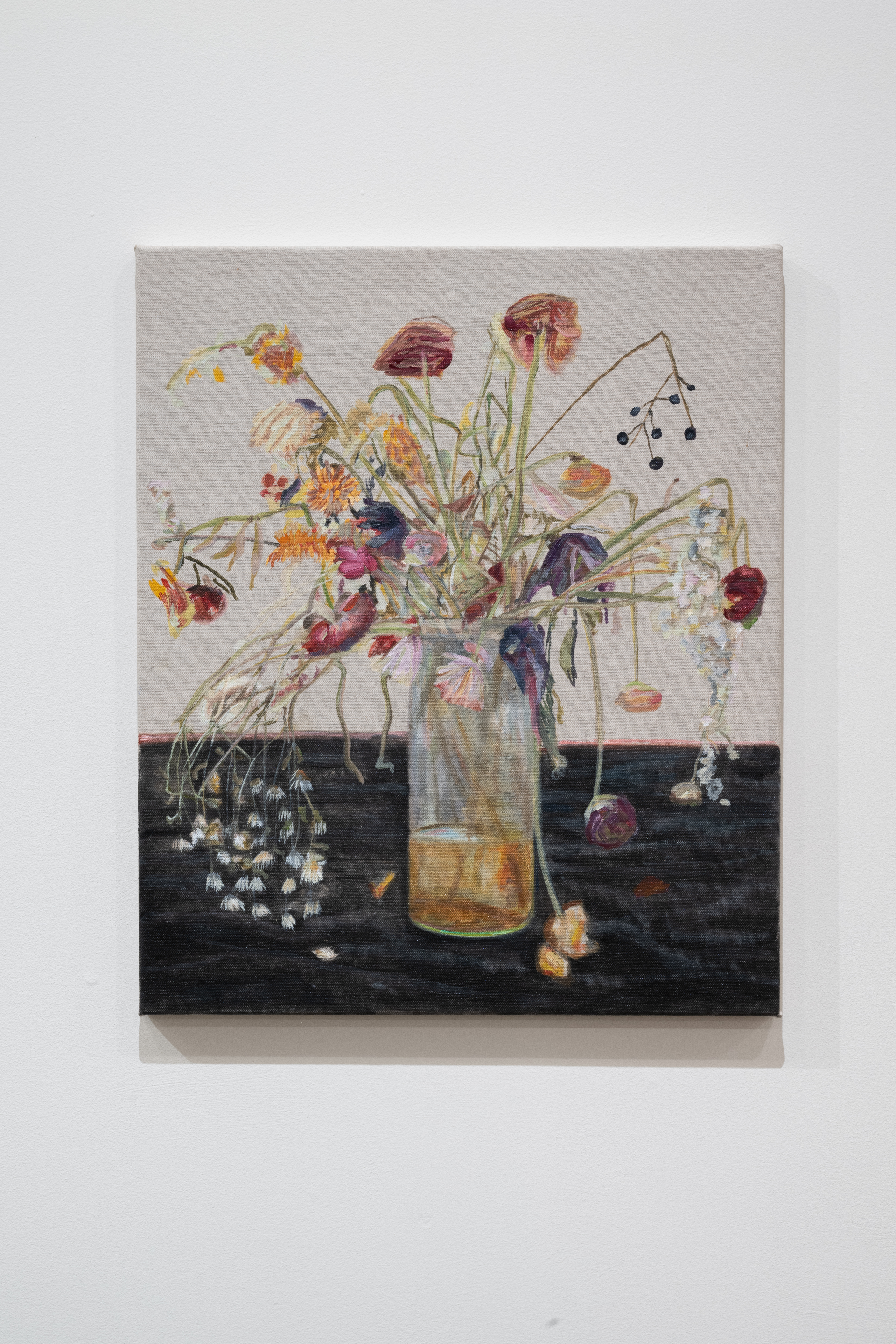 Color image of an oil painting of a flower arrangment, placed in a glass jar on a black table. The flowers are dying and falling over the sides of the jar, which holds a shallow amount of yellowed water.