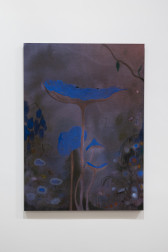 Color image of a watercolor painting. Against a purple and brown background, emerge flowers with bright blue petals opening up in the middle of the composition. In the background, other blue flowers, and plants surround them. A pair of eyes, nose and mouth are painted over the largest blue flower placed in the middle.