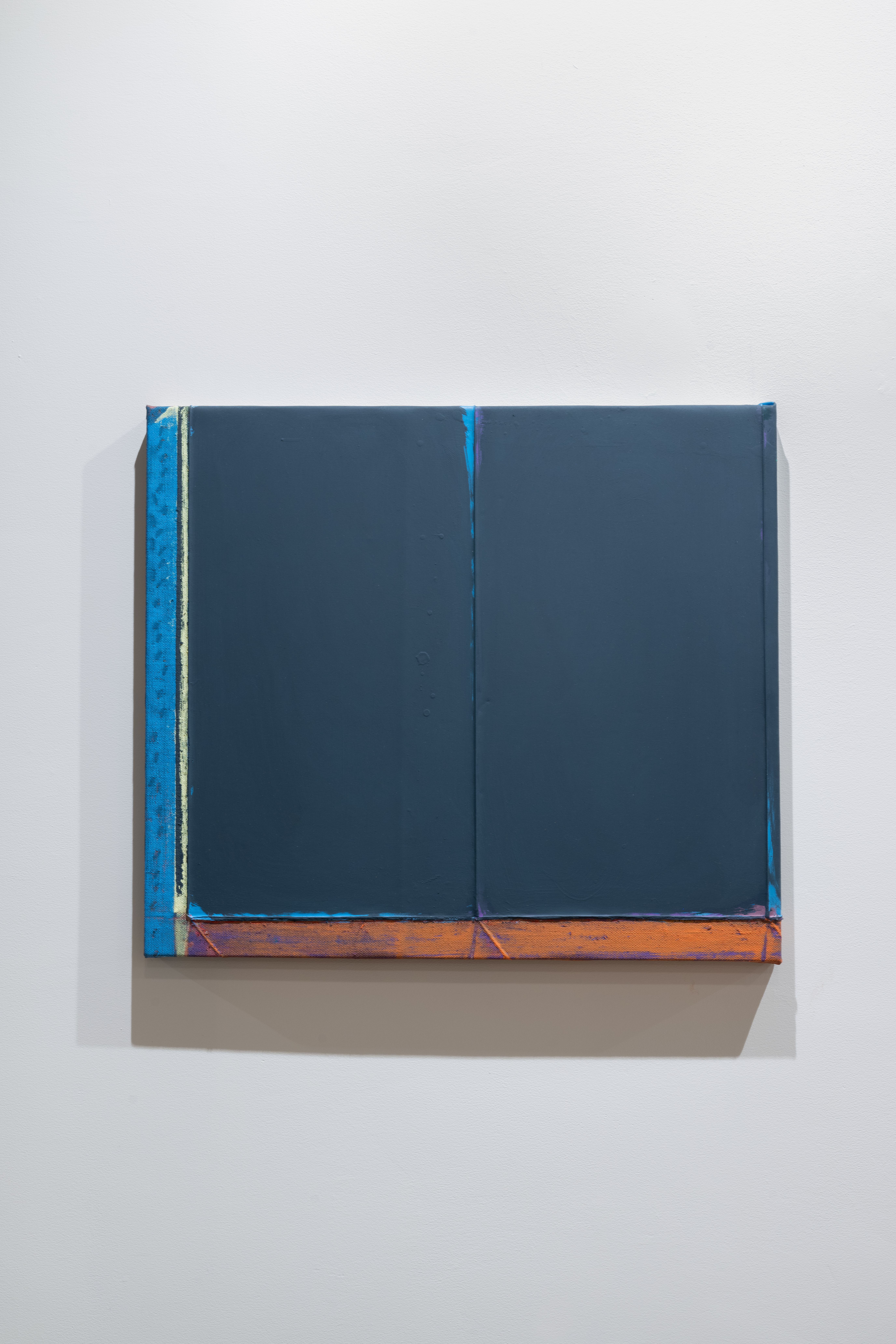 Color image of a painting, done on linen. The left edge is painting a light blue, and the bottom edge is painting orange, with a large rectangle of dark blue paint covering the rest of the work. Accents of light blue paint run through the center and around the edges.