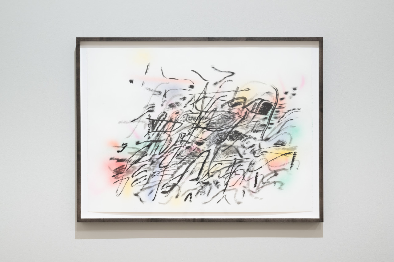 Color image of an abstract painting done on white paper, with black flowing lines running across the composition in various directions, and swathes of colorful paint accenting the background. The lines are blurred, as if in motion.