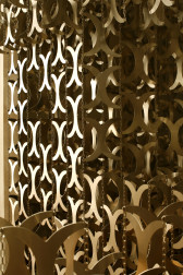 Close-up of a series of metal cutouts shaped like curved 