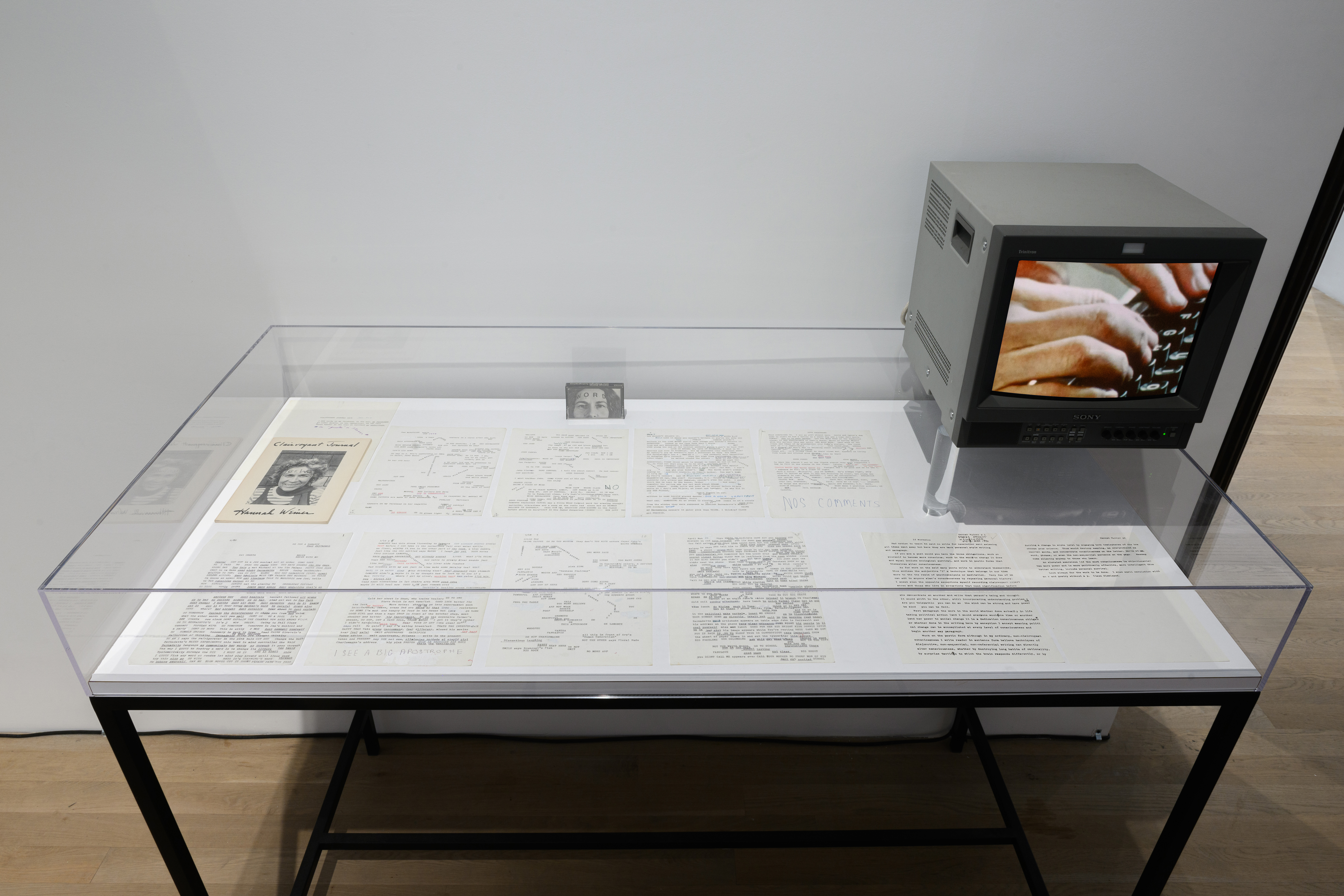 An image of a display case with several letters, and a television sitting on top.