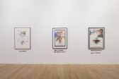 An image of three paintings hanging on a wall.