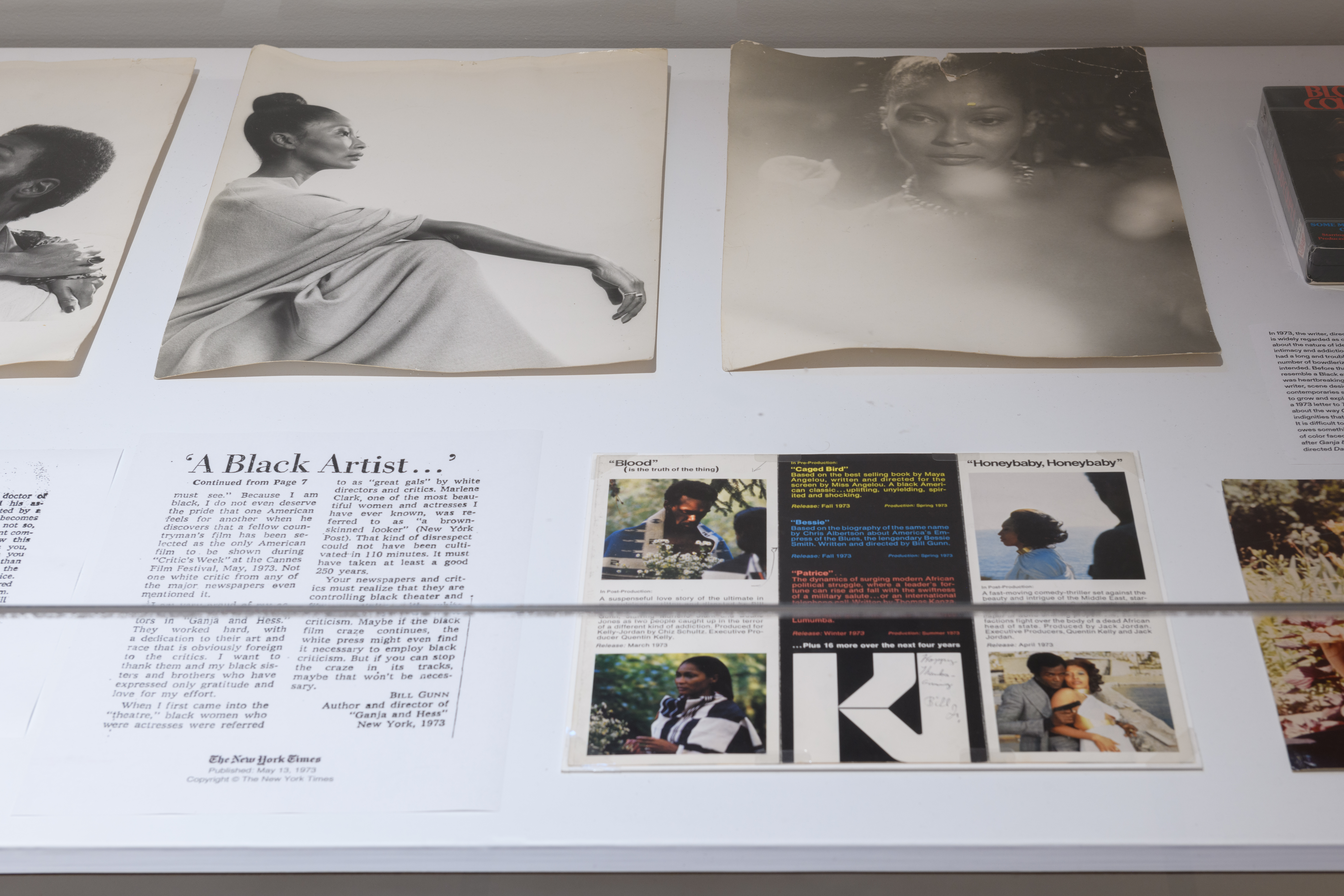 A close up of a glass display case holding multiple images and text.