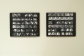 A close up image of two black and white contact sheets mounted on a wall.
