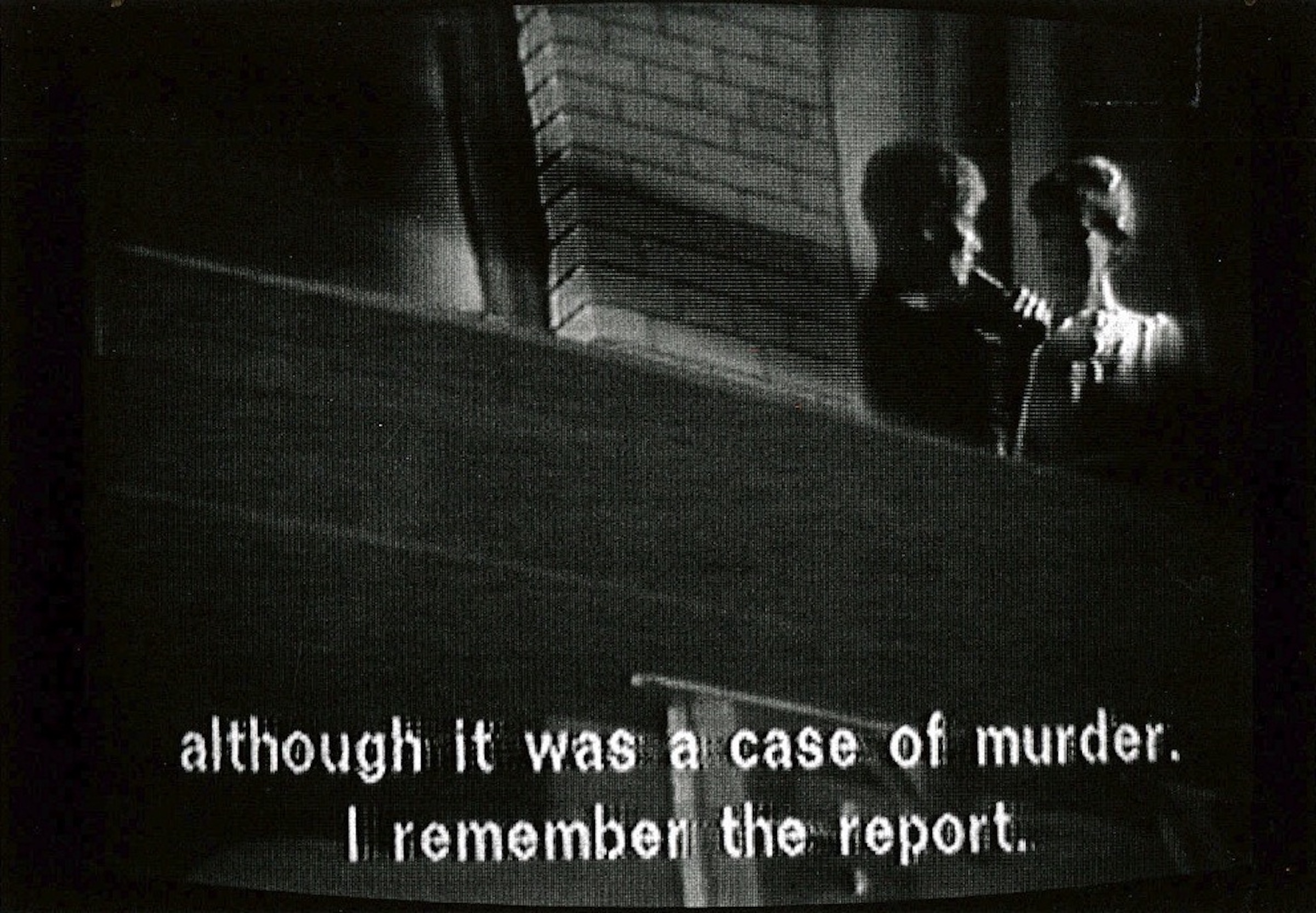 Two people are seen from below, standing and facing one another in a shadowy window.  Below them, the subtitle text reads, 