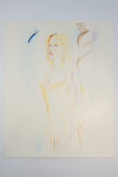 A color image of an unframed drawing of a figure wearing a yellow dress. The figure is seen from a three-quarter view. To the right, near the head, there is a floating blue fish. Behind the figure, a brown column stands.