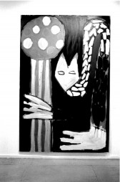 A figurative painting shows a cat-like figure drooping down to grab a long mushroom-like object. Painting appears in a white-walled gallery space.