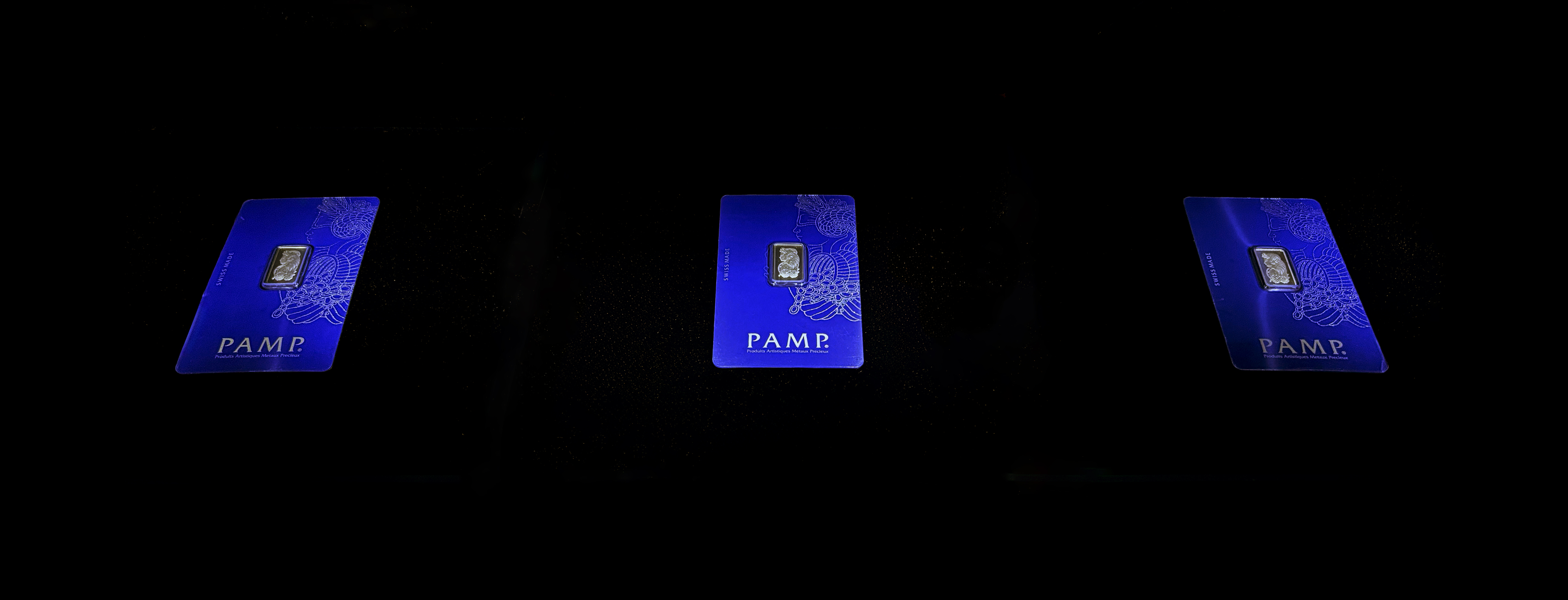 A takeaway artwork shows three 2.5 gram gold bullion bars in blue Pamp Suisse certifying cases. Each bar depicts a low relief icon of Lady Fortuna, the blindfolded goddess of luck, fortune, and chance.