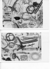 Wires, matches, sticks, bits of string, and other scrap metal pieces are strewn across a white background.