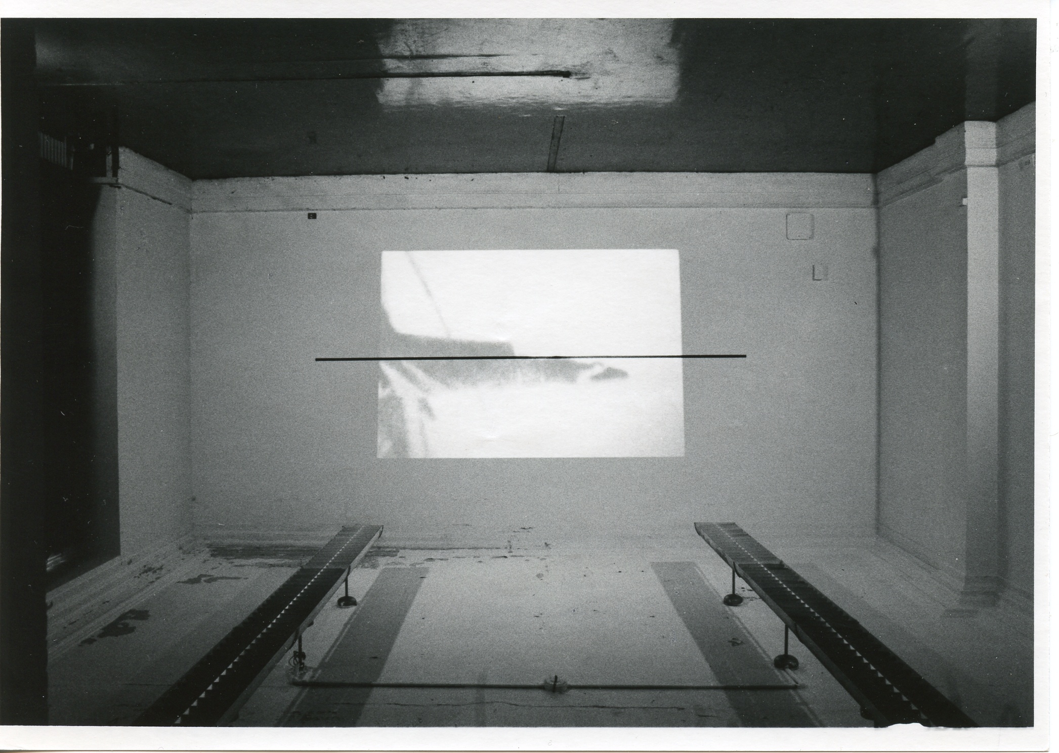 An image is projected onto a white wall.