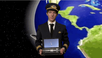 A moving image of a man, dressed in a pilot uniform, in front of a panning image of Earth from space, holding a laptop. The camera zooms in on the video playing on the laptop screen of a man releasing his parachute while skydiving.