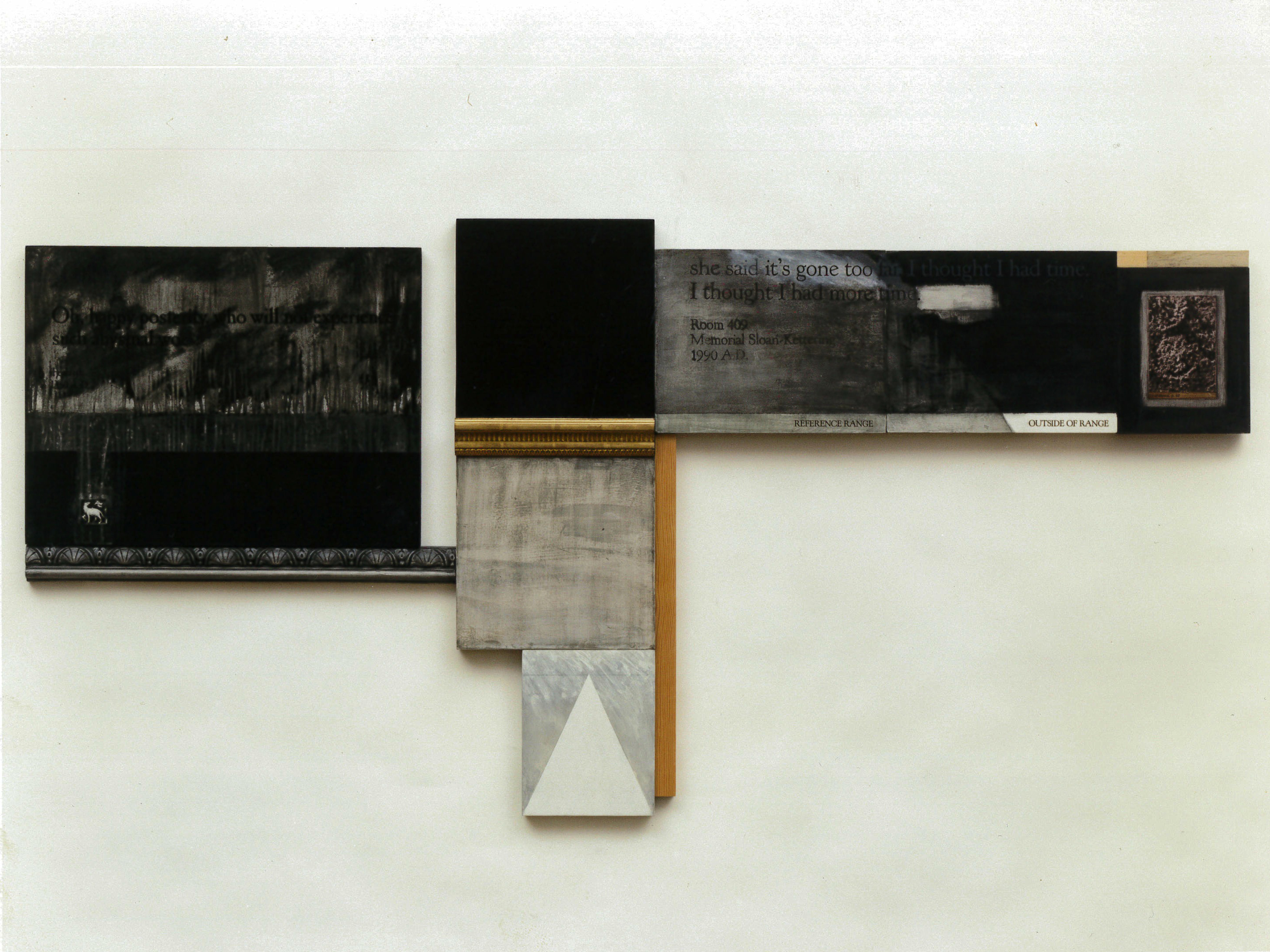 A series of rectangular and square panels, strips of wood, and portions of ornate frames installed on a white wall. The installed elements are positioned adjacent to one another such that they form a larger, irregular shape. The panels feature black, white, and muted colors. Some feature abstract painted compositions and color blocks, others include text and collaged photographs.