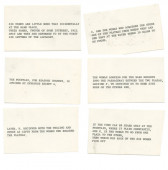 A photograph of six index cards with typed up clues.