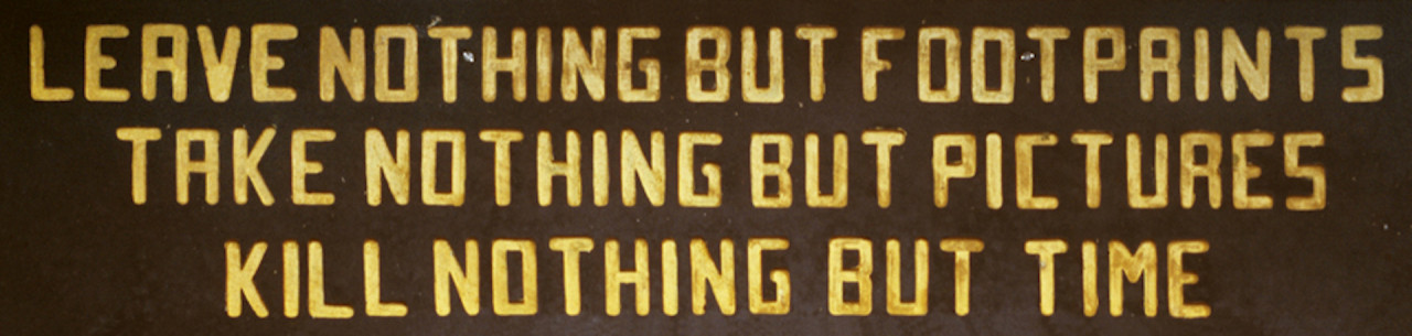 Yellow text on a brown background reading 