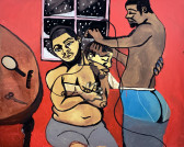 A painting in color of two Black Queer people in a red interior setting. One of them, wearing gray underpants, gazes out of the picture plane, while another profile of their head turned to the right is superimposed. The barber on their right is shaping the seated person’s hair with clippers. The rounded edge of a tabletop with a mirror, comb, and shears atop of it is pictured to the left of the image. A single window depicting snowfall at night can be seen behind the two Black Queer figures.