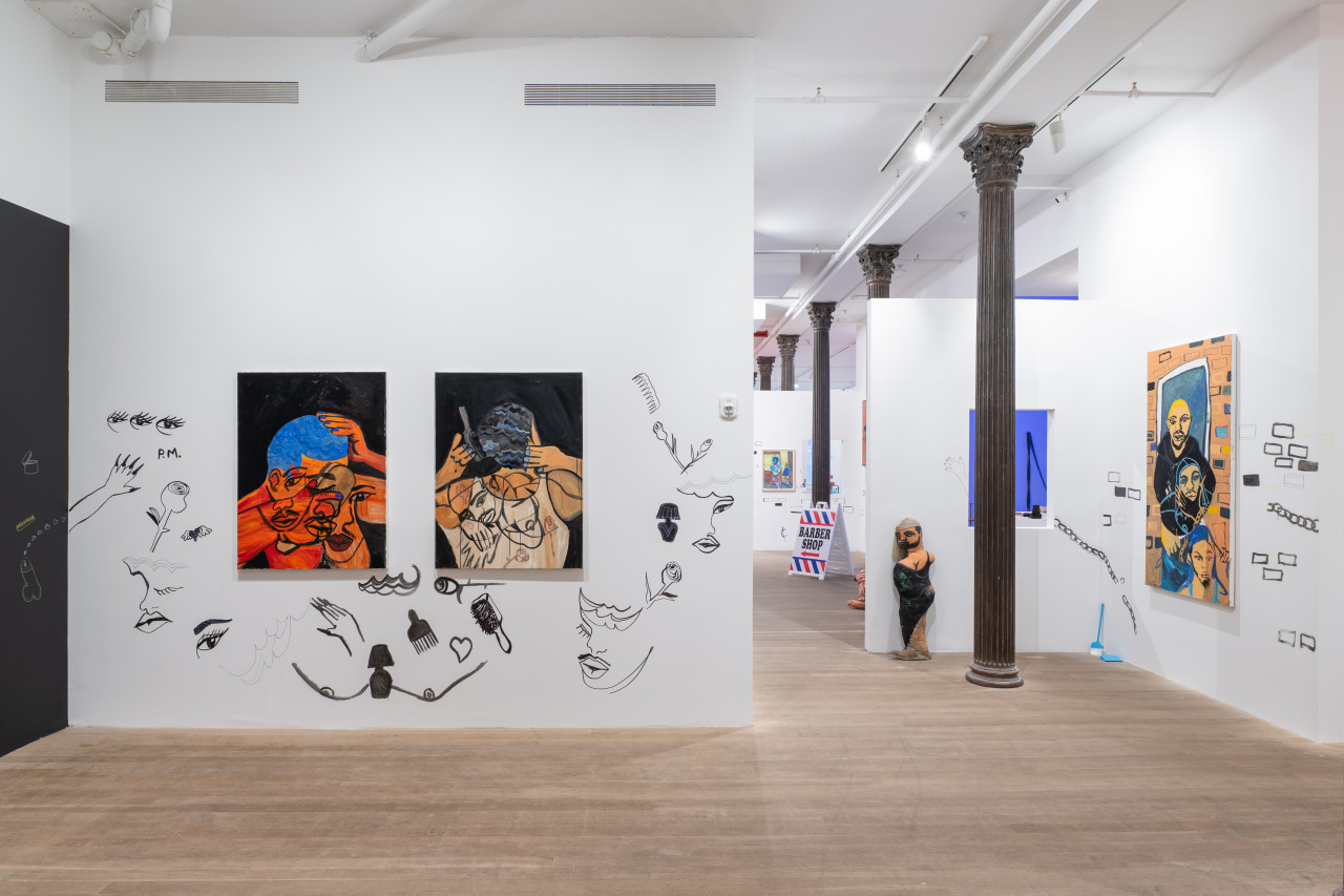 A color image of a gallery space, with large paintings of Black Queer figures placed on white walls. Drawings in black accent the walls and complement the paintings. Past the left wall is a corridor leading into the next room. In the distance is a white sign on the floor, reading "BARBER SHOP."