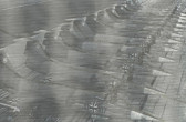 A gray-toned illustration of multiple, military missles, lined up next to one another.