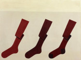 An image of three red socks, accordion folded in the center of the leg.
