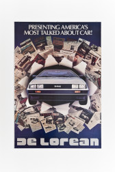 A poster showing a silver car driving through a selection of press clippings from newspapers on a blue background. At the top of the image, there is white text that reads, 