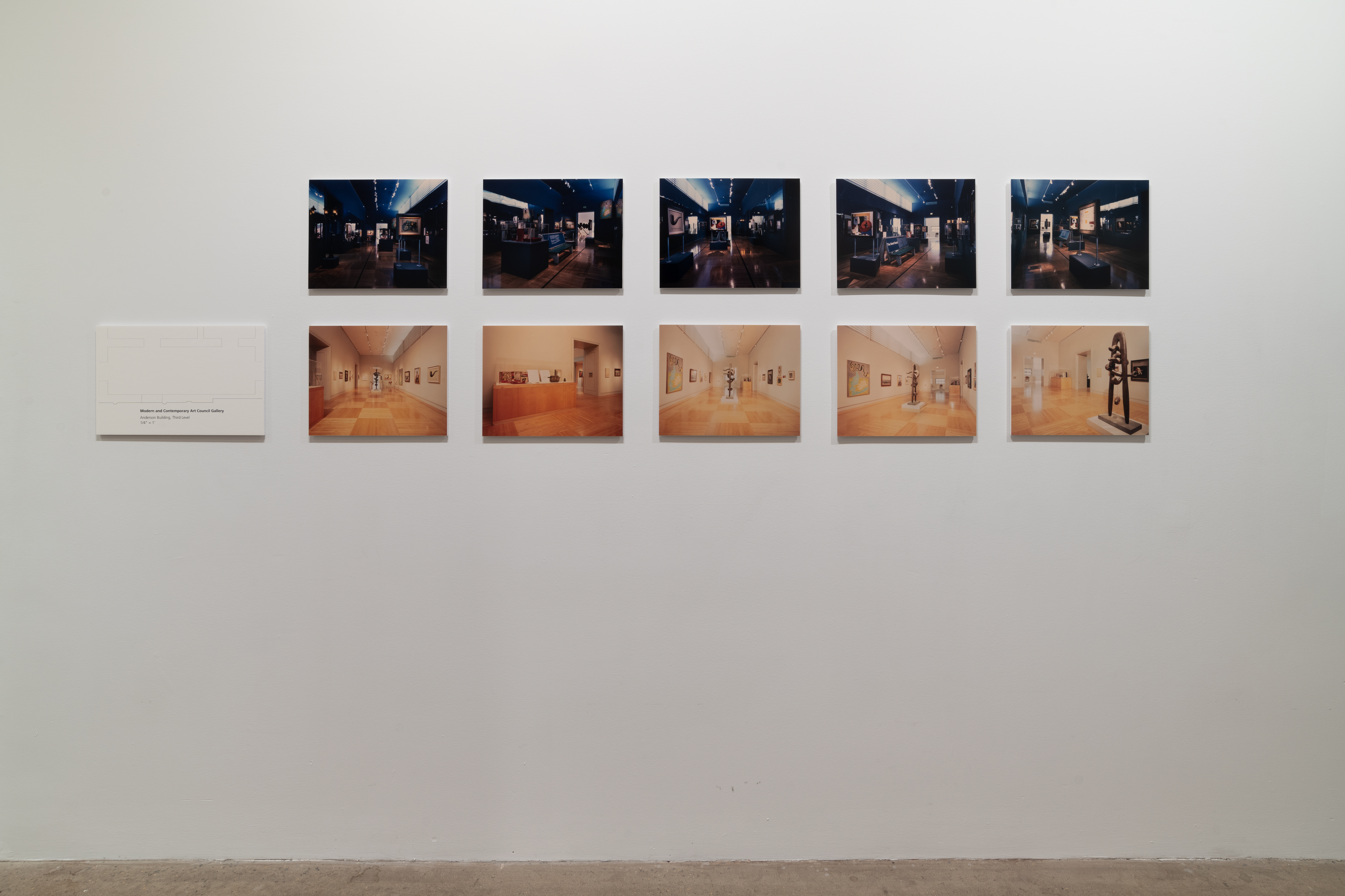 Ten photographs are displayed on a white gallery wall. The photographs are arranged into two identical rows. The photographs along the top are darker and cool toned. The photographs along the bottom are much brighter and warm toned. To the left of the photographs is a white panel that shows the floor plan of a gallery.