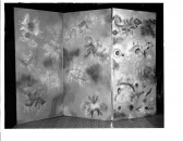 Three panels with animal-like figure outlines appear on the floor opened out with a black background.