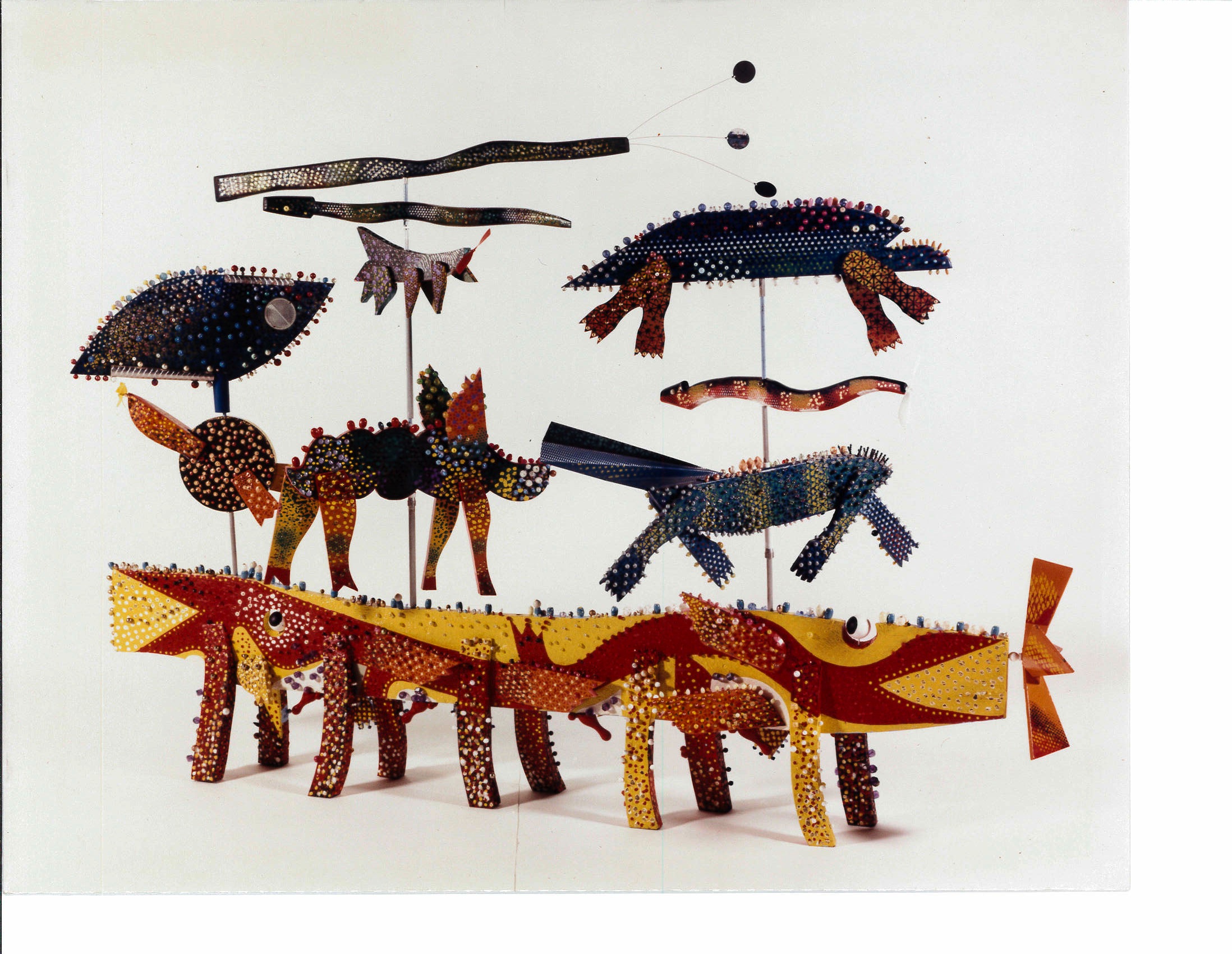 A number of colorful animal-like figures appear in space with a white background.