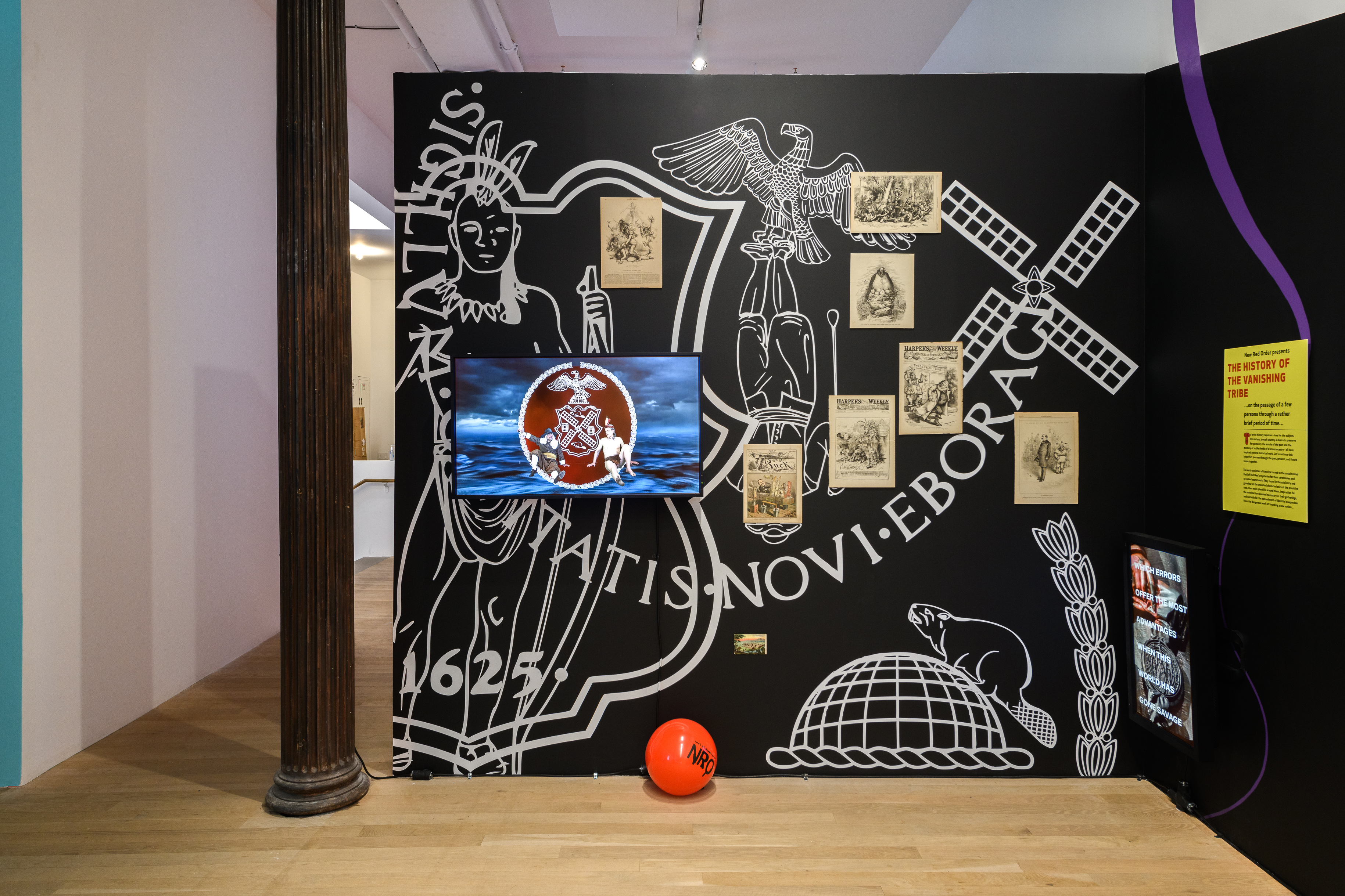 A black wall that reads  