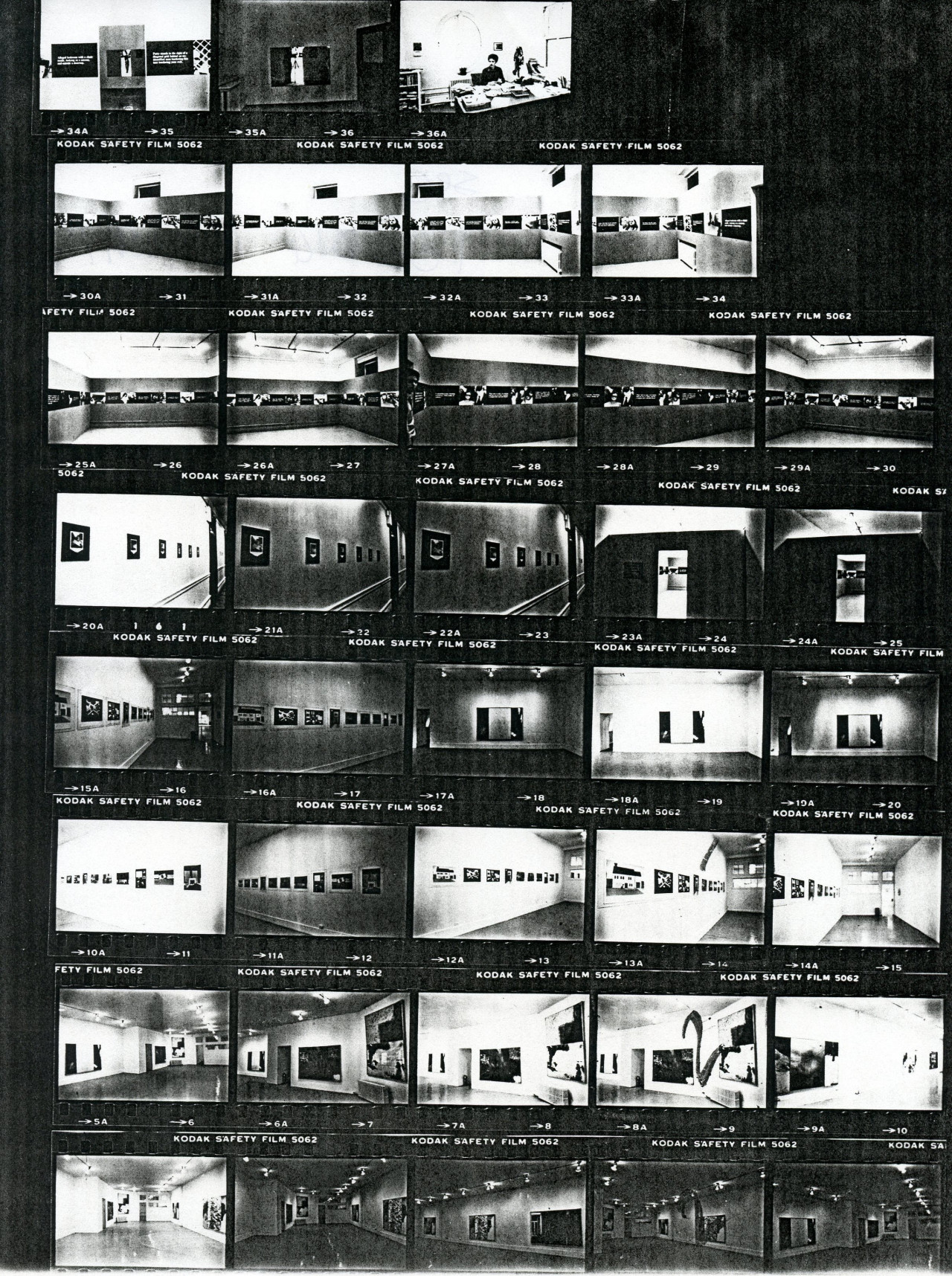 Contact sheet of installation images showing artwork hung up on walls .