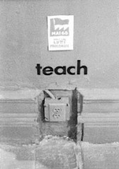 A somewhat indistinguishable image is on a wall above black letter that reads 