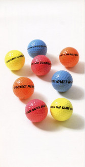 Eight vibrantly colored blue, pink, yellow, and orange golf balls rest on a white backdrop. Various statements written in black capitalized text adorn each gold ball, including phrases such as, 
