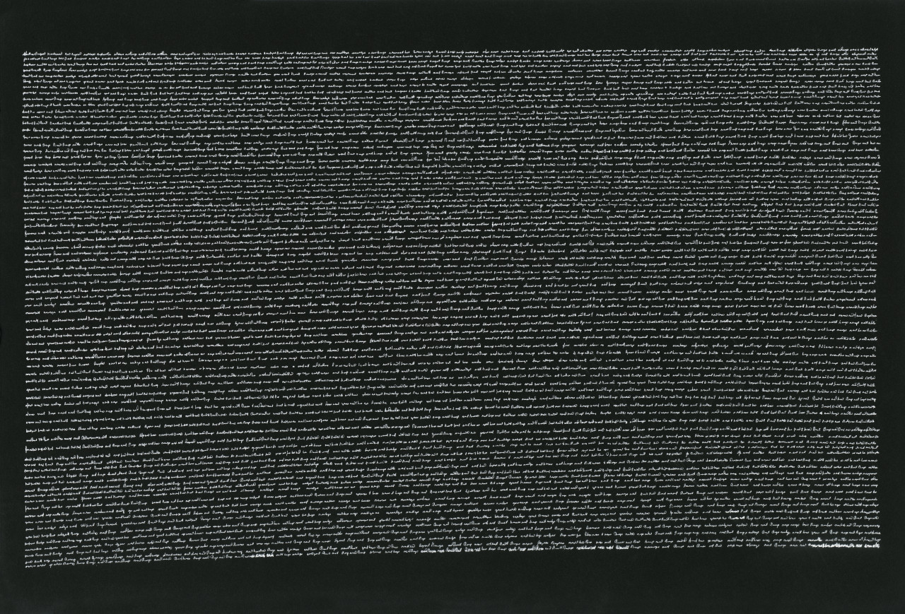 A block of horizontal, very small cursive text is written in white on a black background.