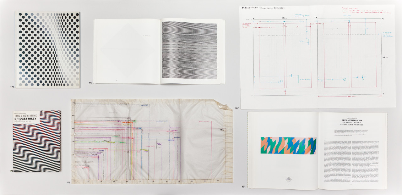 A grid of 6 documents sitting opened on a table.