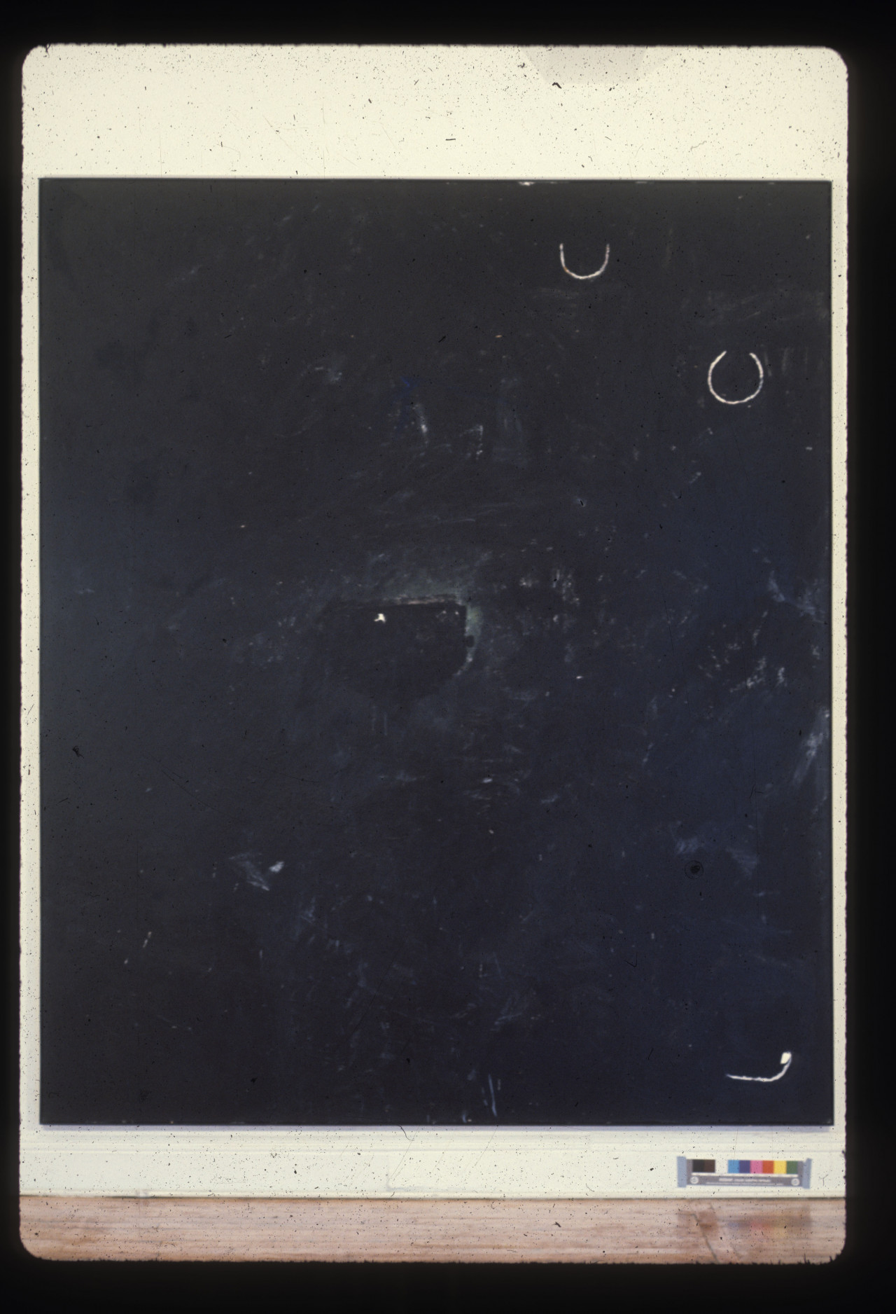 A color installation photograph of a black and white abstract painting on a white wall.