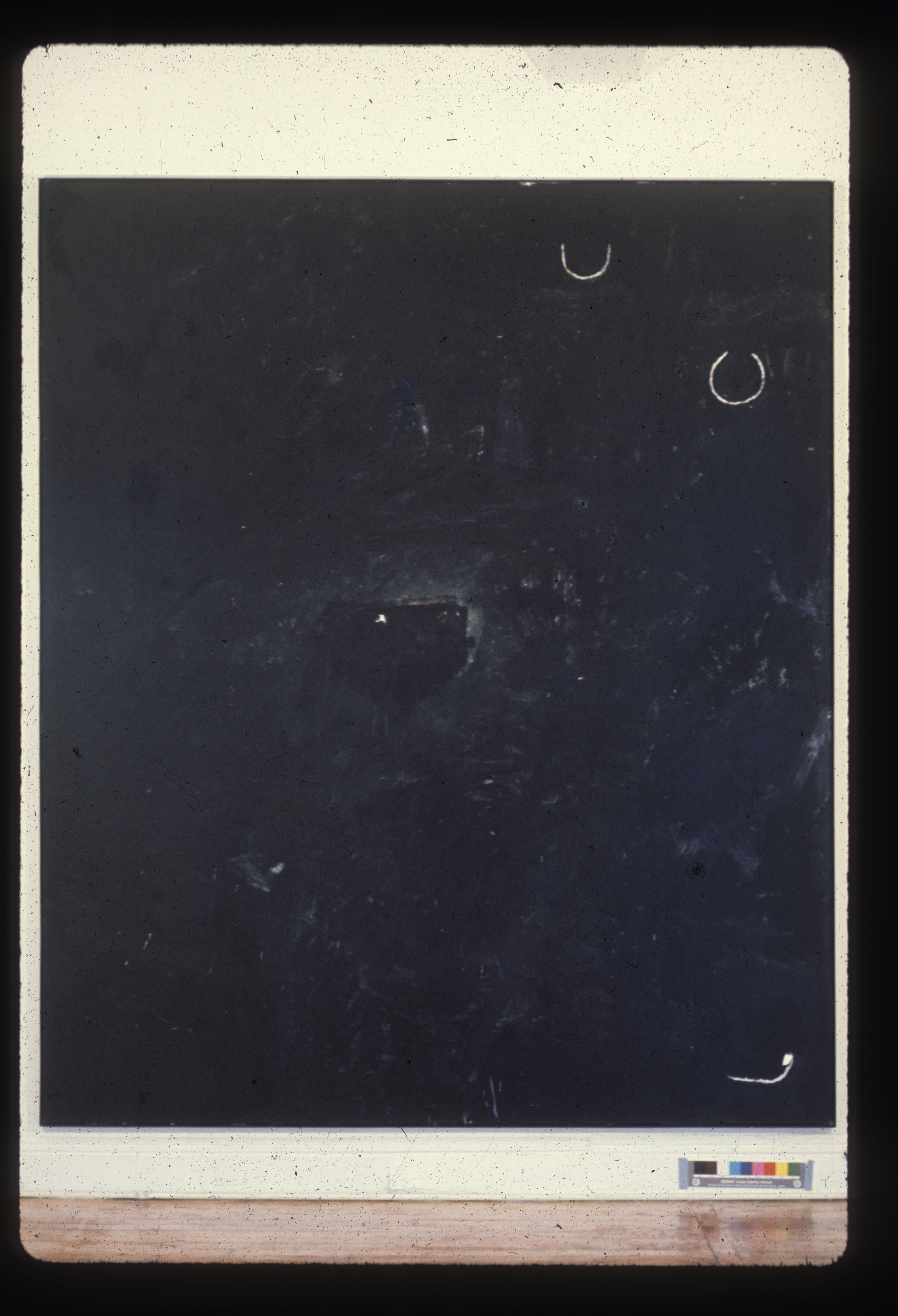 A color installation photograph of a black and white abstract painting on a white wall.