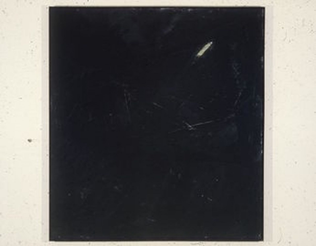 A color installation photograph of a black and white abstract painting on a white wall.