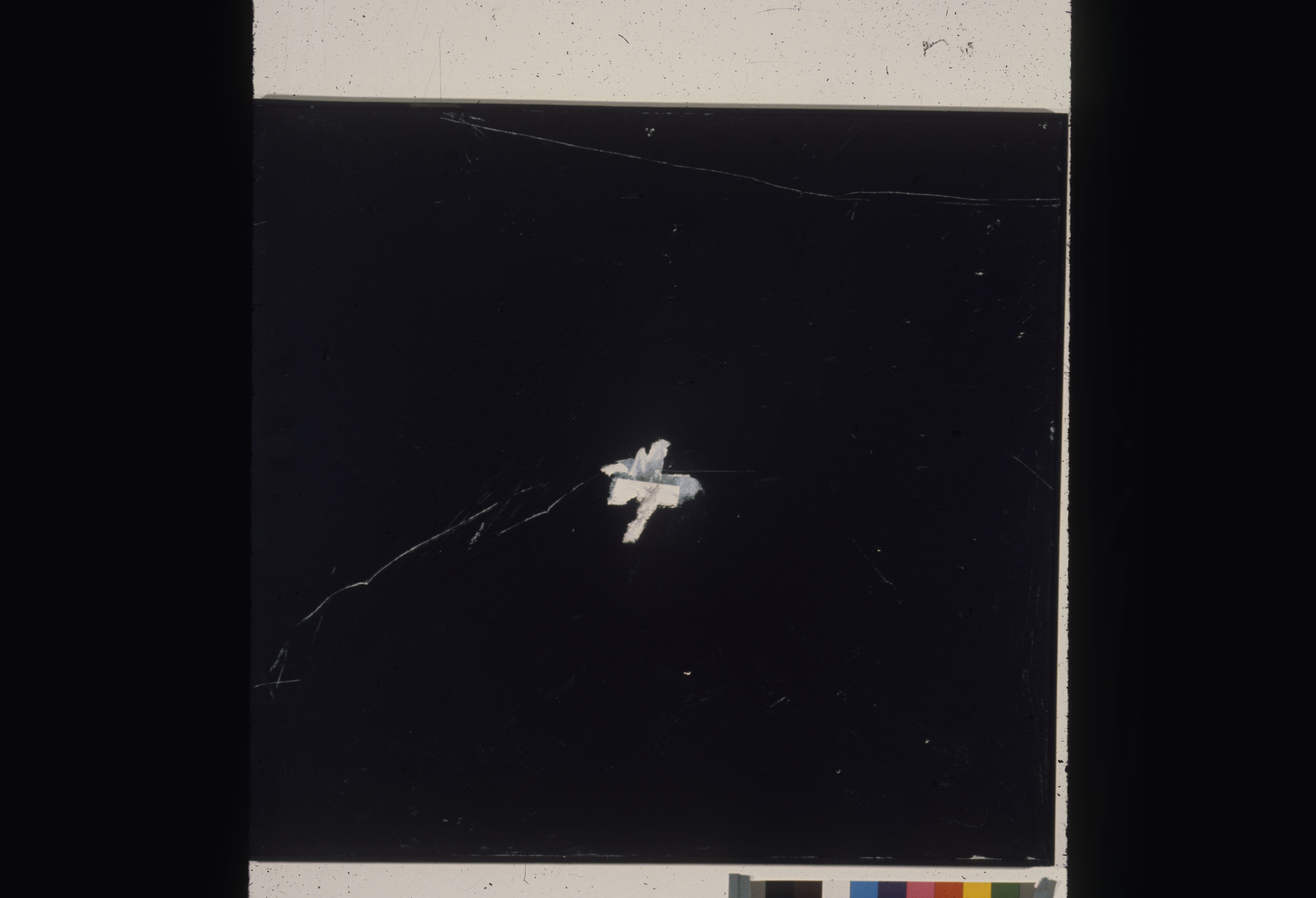 A color installation photograph of a black and white abstract painting on a white wall.