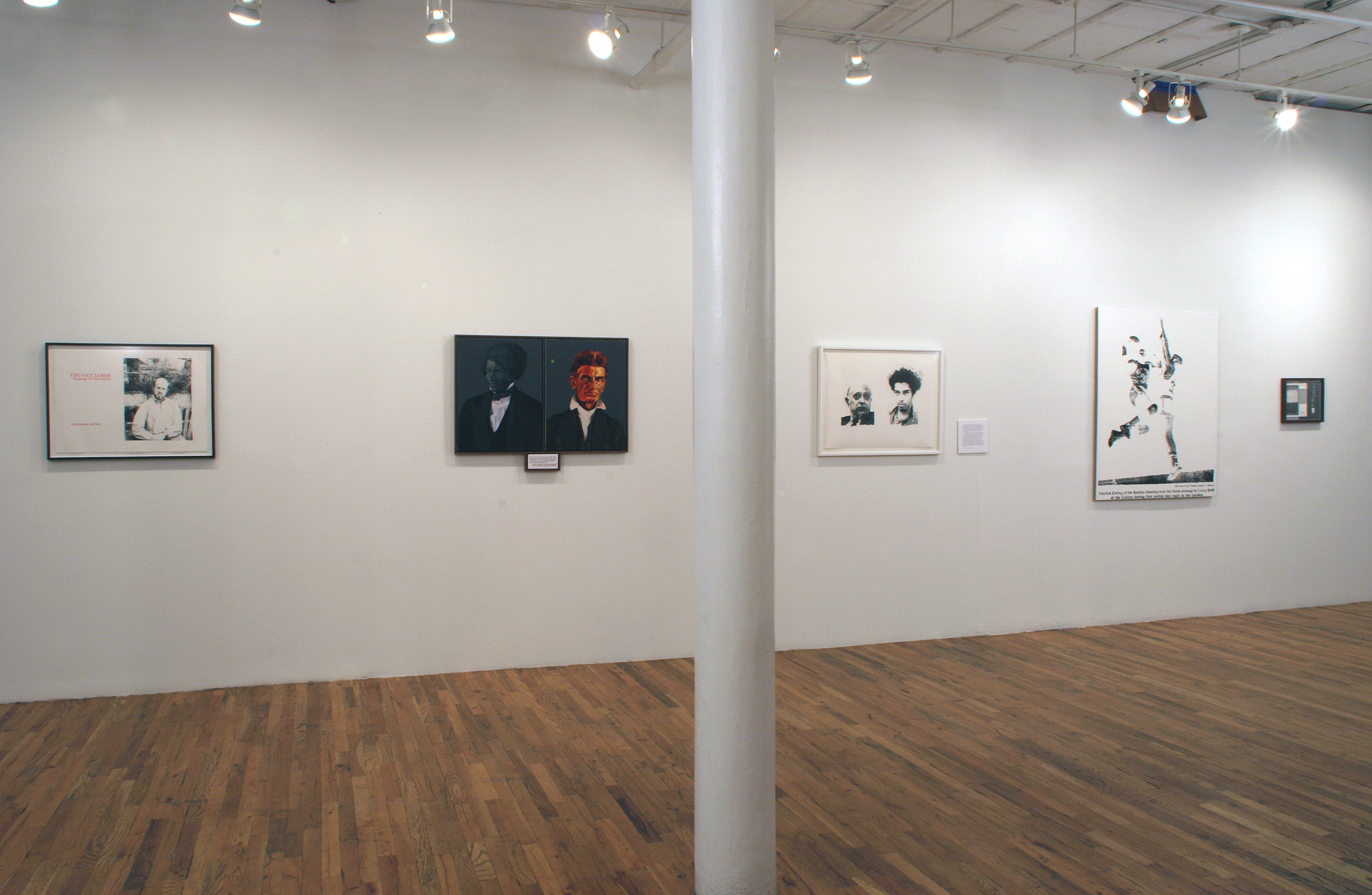 A set of five paintings, prints, and other works on paper hang in a horizontal line across a white gallery wall. The compositions each depict one or more figures. Some sit, as if for a portrait, while others appear to play basketball. One of the gallery columns is situated in the image's center.