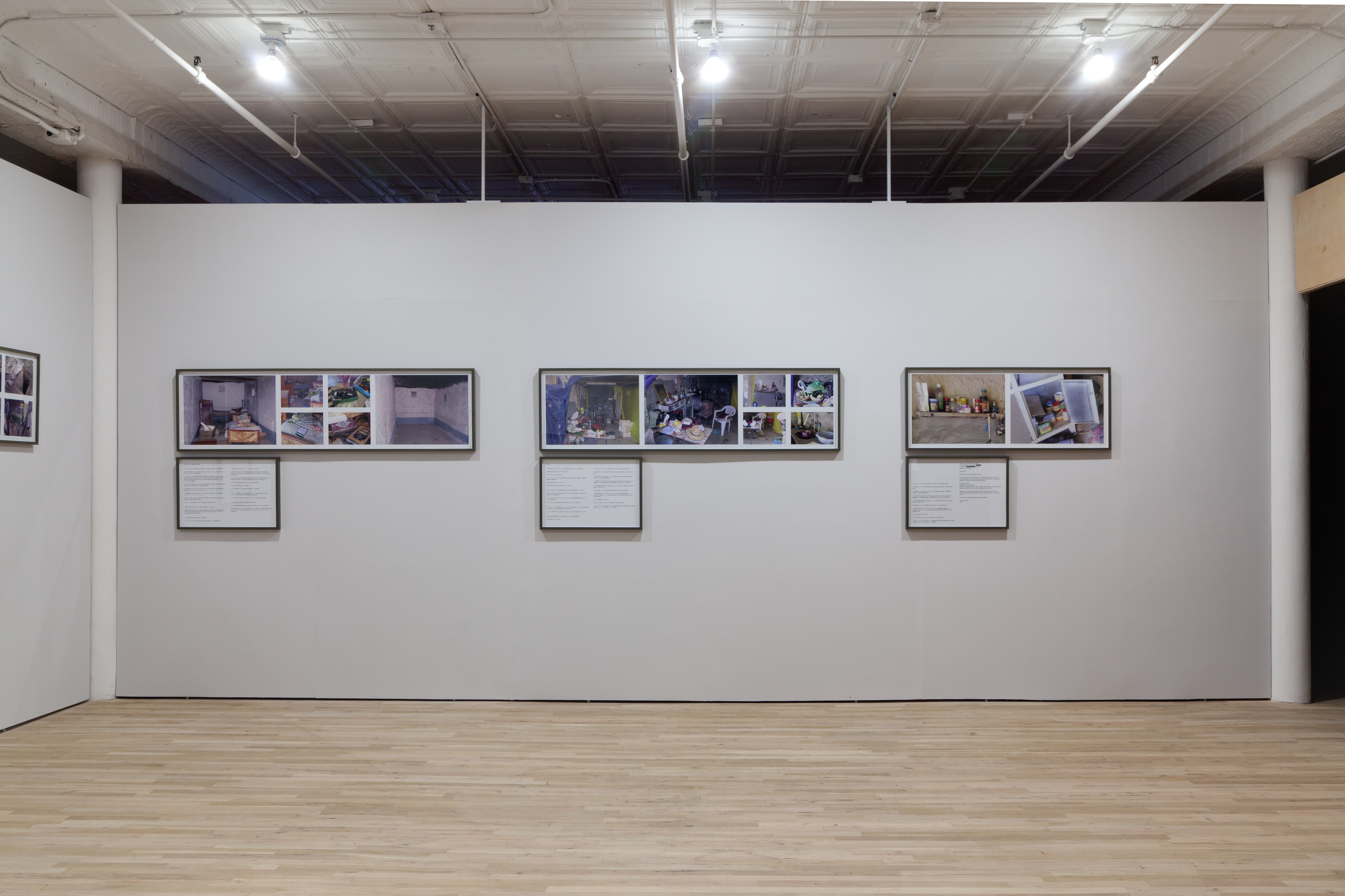 A white wall with three sets of multiple photographs of rooms. Each set of photographs has a framed accompanying text below.