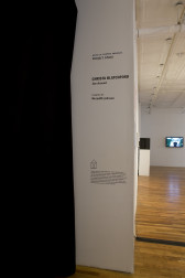 A corner of a wall imposed with the text, 