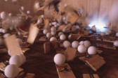 Mousetraps on a wooden floor in motion, snapping to capture ping pong balls resting atop them.