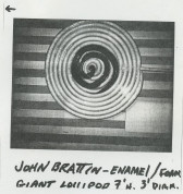 A black and white Polaroid of a swirl on a striped background. At the bottom of the image, black handwritten text reads, 