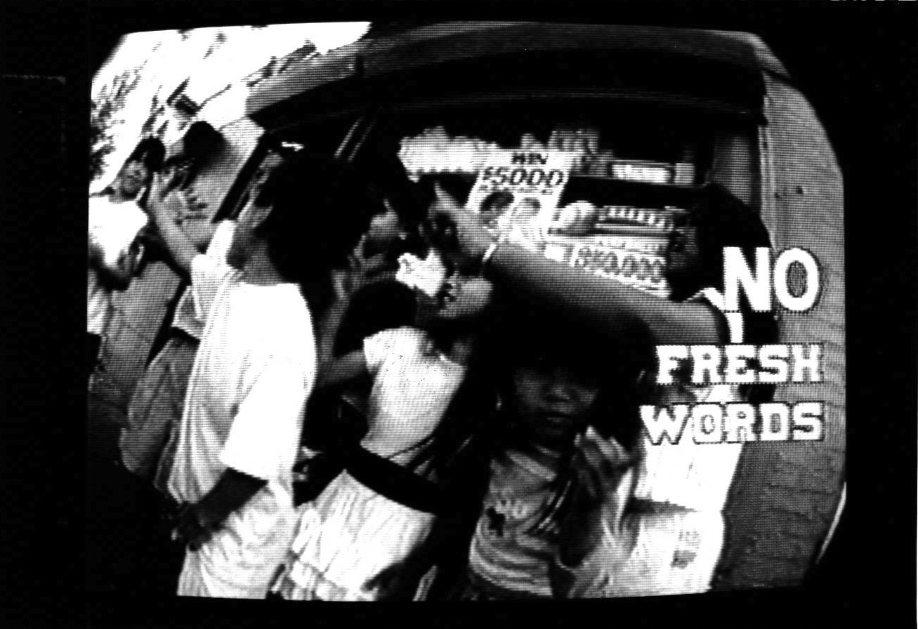 A black and white image of a group of children clustered in front of a store window.  On the right, the text 