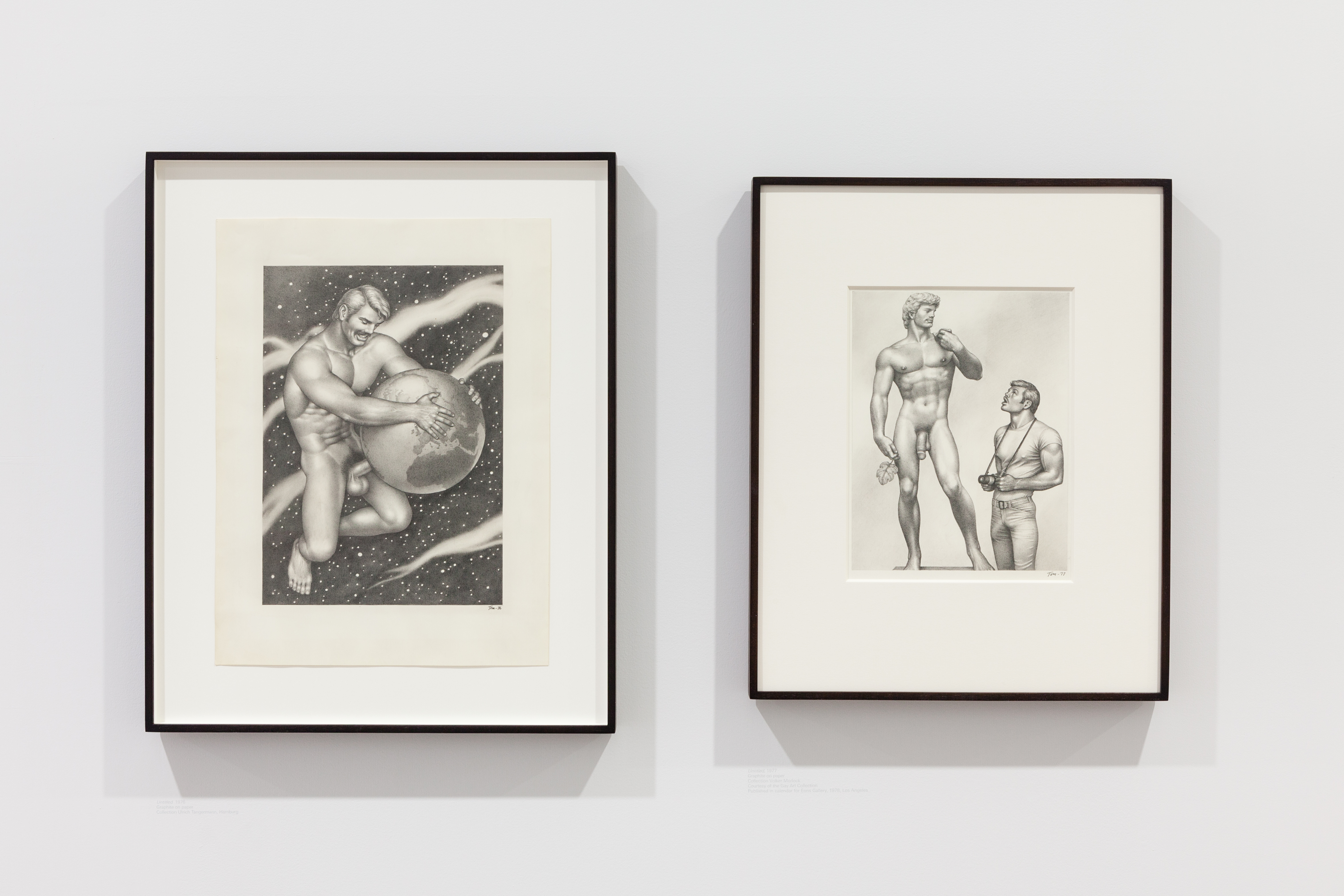 Two illustrations hung on a wall. On the right, a naked man inserts his penis into the a globe. On the left, a man gazes up at a rendering of Michealangelo's 